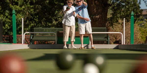 Two Paradise Valley Estates' residents ponder their next move on bocce on the Paradise Valley Estates bocce court.