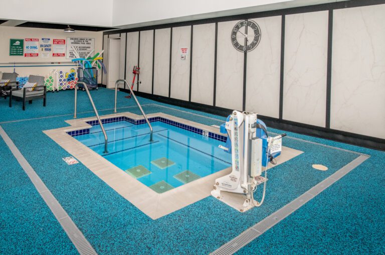 A photo of the Paradise Valley Estates hot tub, complimented by a mobility bench.